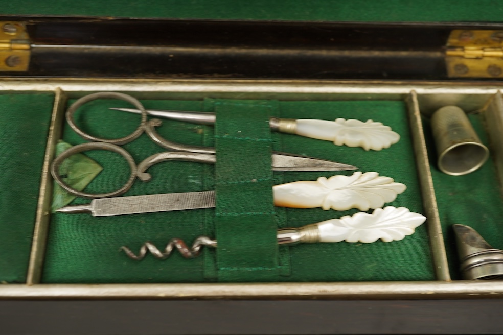 A mid 19th century rosewood writing and sewing box